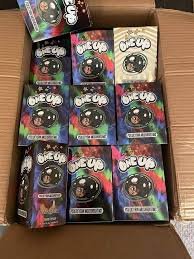 Psychedelics One Up Mushroom Bars mushroom-infused chocolate, featuring vibrant packaging and premium psilocybin blend for a unique experience